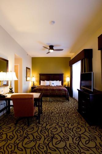 a hotel room with a bed and a television at Homewood Suites by Hilton Las Vegas Airport in Las Vegas