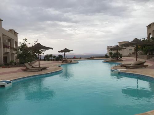 Bazén v ubytování Sea View -SunnyDahab Resort nebo v jeho okolí