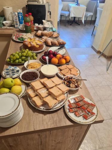 a table with a bunch of different types of food at Agriturismo Cara Terra Lucana in Chiaromonte