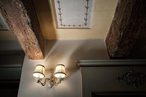 a pair of lights on a wall in a room at Domus Zamittello in Valletta