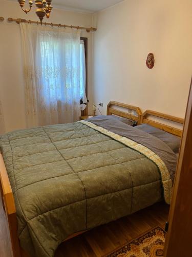 Postelja oz. postelje v sobi nastanitve Appartamento Pelmo