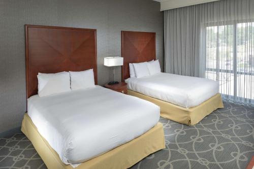 a hotel room with two beds and a window at DoubleTree by Hilton Biltmore/Asheville in Asheville