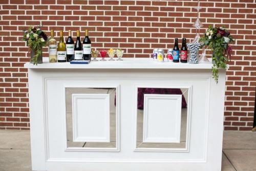 a white bar with bottles of wine on it at DoubleTree by Hilton Biltmore/Asheville in Asheville