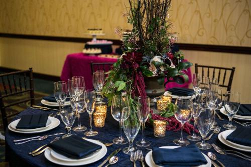 a table with wine glasses and a blue table cloth at DoubleTree by Hilton Biltmore/Asheville in Asheville