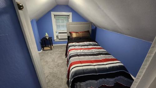 Ένα ή περισσότερα κρεβάτια σε δωμάτιο στο The Unique Place