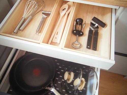 a drawer full of kitchen utensils in a cabinet at Ferienwohnung Werner in Inzell