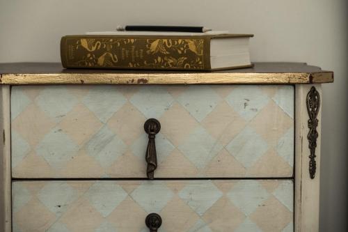a dresser with a book on top of it at Domus Zamittello in Valletta