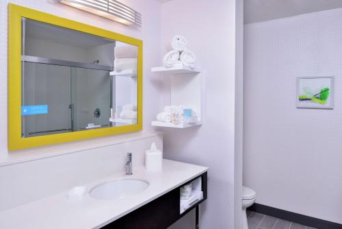 a bathroom with a sink and a mirror at Hampton Inn & Suites Atlanta/Marietta in Marietta