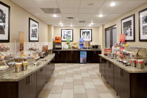 a restaurant with a buffet line with food at Hampton Inn & Suites Chicago/Saint Charles in Saint Charles