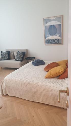 Postel nebo postele na pokoji v ubytování TENNiS Sopot