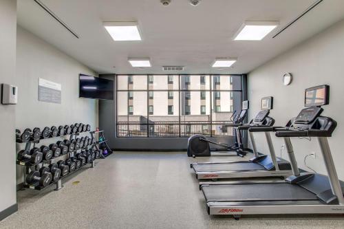 a gym with tread machines and a large window at Hilton Garden Inn Dallas-Central Expy/North Park Area, Tx in Dallas
