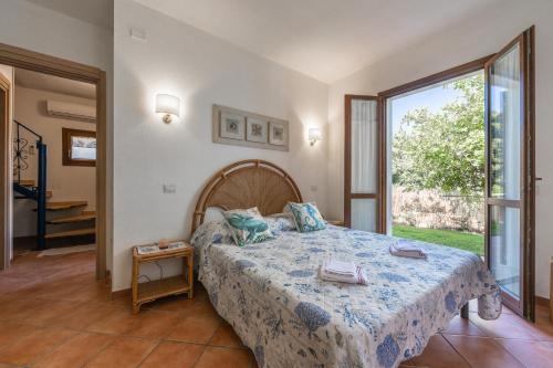 Giường trong phòng chung tại D Home Costa Rei