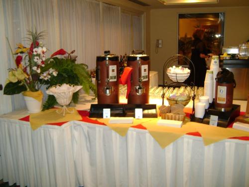 a table with some candles and flowers on it at Hilton Garden Inn Redding in Redding