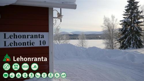 a sign that says lechamania electronic in the snow at Talo Ylläs in Äkäslompolo