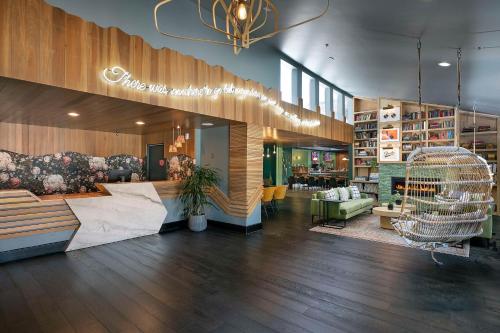 a lobby of a store with a bird cage in it at The Wayfarer San Luis Obispo, Tapestry Collection by Hilton in San Luis Obispo