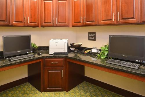 two computer monitors sitting on a desk in an office at Hampton Inn Alpine in Alpine