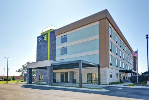 an office building with a sign on the front of it at Home2 Suites By Hilton Conway in Conway