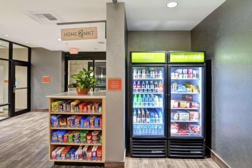 a store with two refrigerators in a store at Home2 Suites By Hilton Conway in Conway
