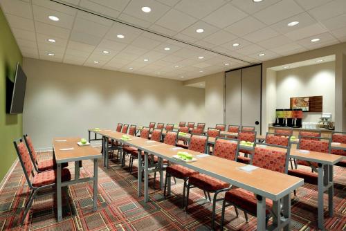 a conference room with long tables and chairs at Home2 Suites by Hilton Cleveland Independence in Independence