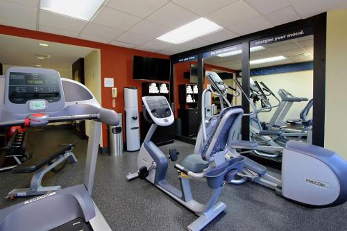 a gym with several treadmills and cardio machines at Hampton Inn Philadelphia-Great Valley in Frazer