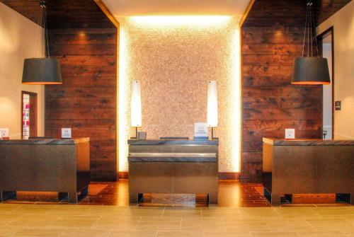 a lobby with wooden walls and a cash register at DoubleTree by Hilton Hotel Reading in Reading