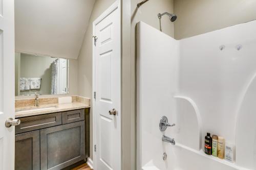 a bathroom with a shower and a sink at Cozy Covington Studio Rental Near Historic Square! in Covington