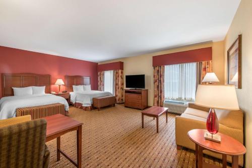 a hotel room with two beds and a television at Hampton Inn & Suites Arcata in Arcata