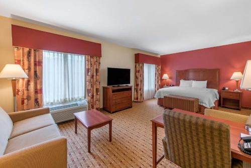 a hotel room with a bed and a television at Hampton Inn & Suites Arcata in Arcata