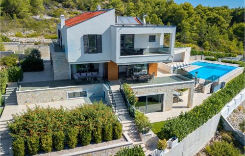 an aerial view of a house with a swimming pool at Villa Marko in Tribunj