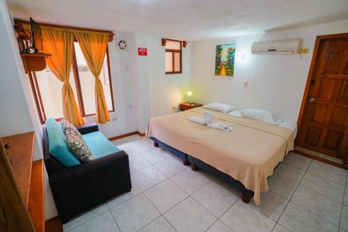 Cama o camas de una habitación en Galapagos Verde Azul