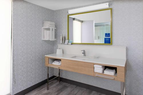 a bathroom with a sink and a mirror at Hampton Inn Las Vegas/Summerlin in Las Vegas