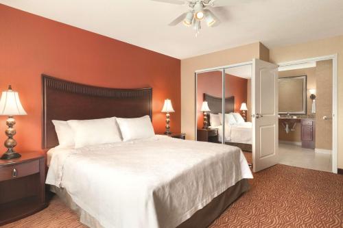 a hotel room with a large bed and a bedroom at Homewood Suites Medford in Medford