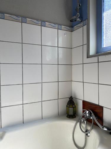 a bathroom with a sink with a faucet at Thathe Dam Lodge in Vhutandabos