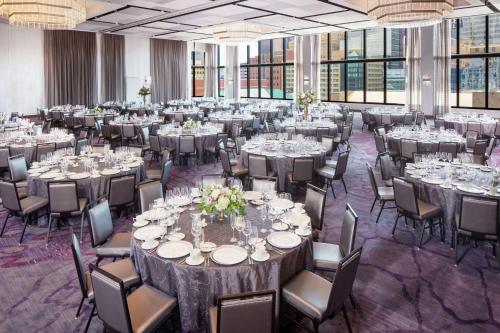 a large banquet hall with tables and chairs at Hilton Rochester Mayo Clinic Area in Rochester