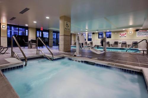 a large pool of water in a building at Hilton Garden Inn Lincoln Downtown/Haymarket in Lincoln