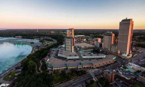 an aerial view of a city with a river and buildings at Hilton Niagara Falls/ Fallsview Hotel and Suites in Niagara Falls