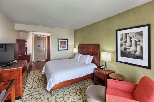 a hotel room with a bed and a television at Hilton Garden Inn Durham-University Medical Center in Durham