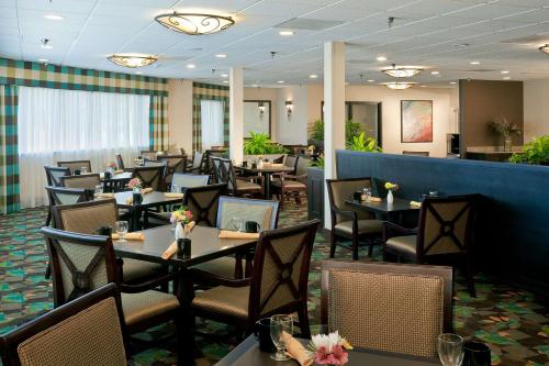 a dining room with tables and chairs in a restaurant at DoubleTree by Hilton Santa Fe in Santa Fe