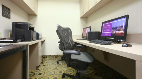 an office with a desk with a computer and a chair at Hilton Garden Inn Secaucus/Meadowlands in Secaucus