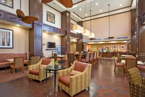 a lobby of a hotel with chairs and tables at Hampton Inn & Suites New Braunfels in New Braunfels
