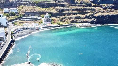 an aerial view of a beach with blue water at Studio with wonderful ocean view and free WiFi, in Icod de los Vinos in Icod de los Vinos