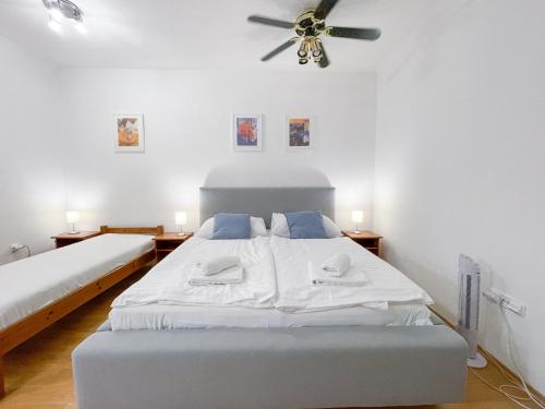 Кровать или кровати в номере Penzion Portus