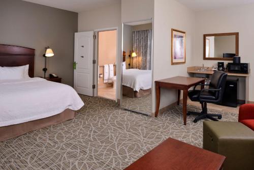 a hotel room with a bed and a desk at Hampton Inn Litchfield in Litchfield