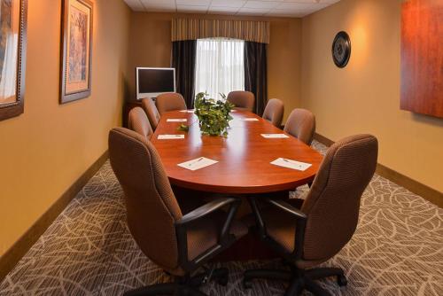 a conference room with a wooden table and chairs at Hampton Inn by Hilton Litchfield in Litchfield