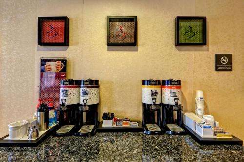 a group of coffee machines sitting on a counter at Hampton Inn Manning in Manning
