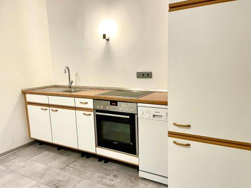 a kitchen with a sink and a stove at Casa Giulia in Gleiberg