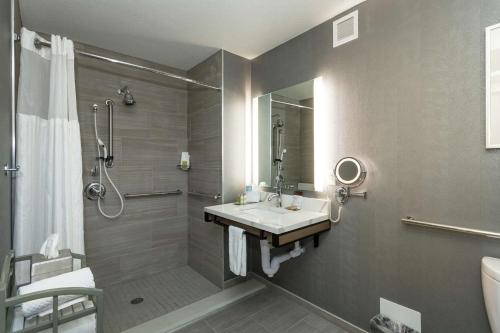 a bathroom with a sink and a shower at Doubletree by Hilton Harrisonburg in Harrisonburg