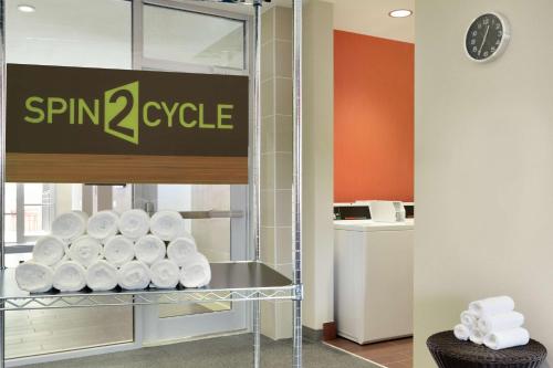 a pile of toilet paper on a shelf in a store at Home2 Suites by Hilton Durham Chapel Hill in Durham