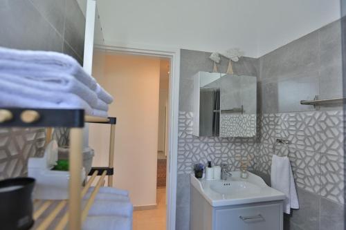a bathroom with a sink and a mirror at Stunning Seaview Haven 3 min to Beach in Lapta in Kyrenia