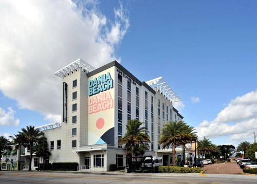 a large white building with a sign on it at Hotel Dello Ft Lauderdale Airport, Tapestry Collection by Hilton in Dania Beach